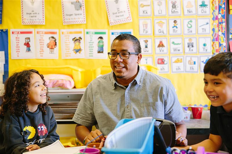 Teacher with his students